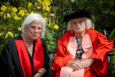 Rosemary Fowler with her daughter Mary Fowler. Both are wearing graduation robes